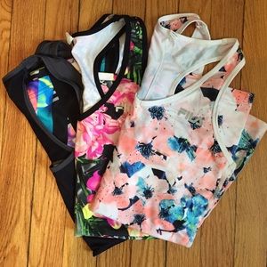 Three fila drifit sport tops with colorful pattern